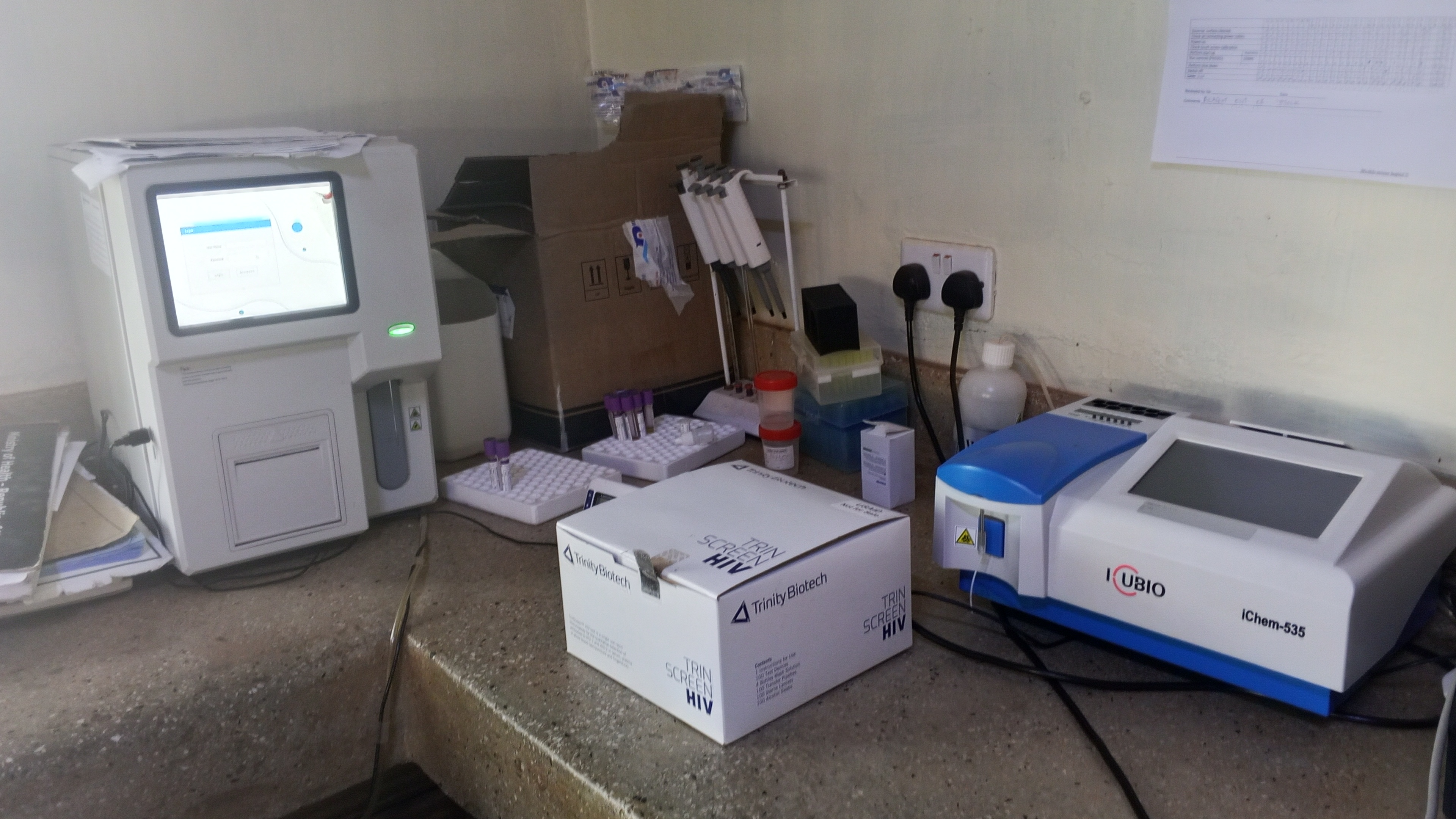 Modern laboratory equipment at Mwihila Mission Hospital including hematology analyzer and chemistry analyzer